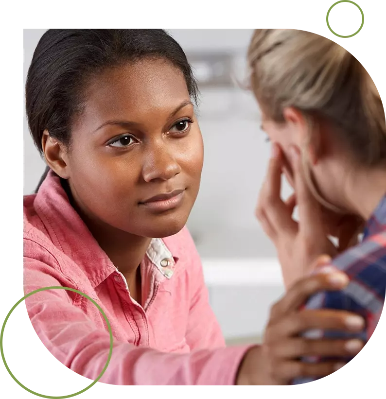 A woman talking to another person in front of her.