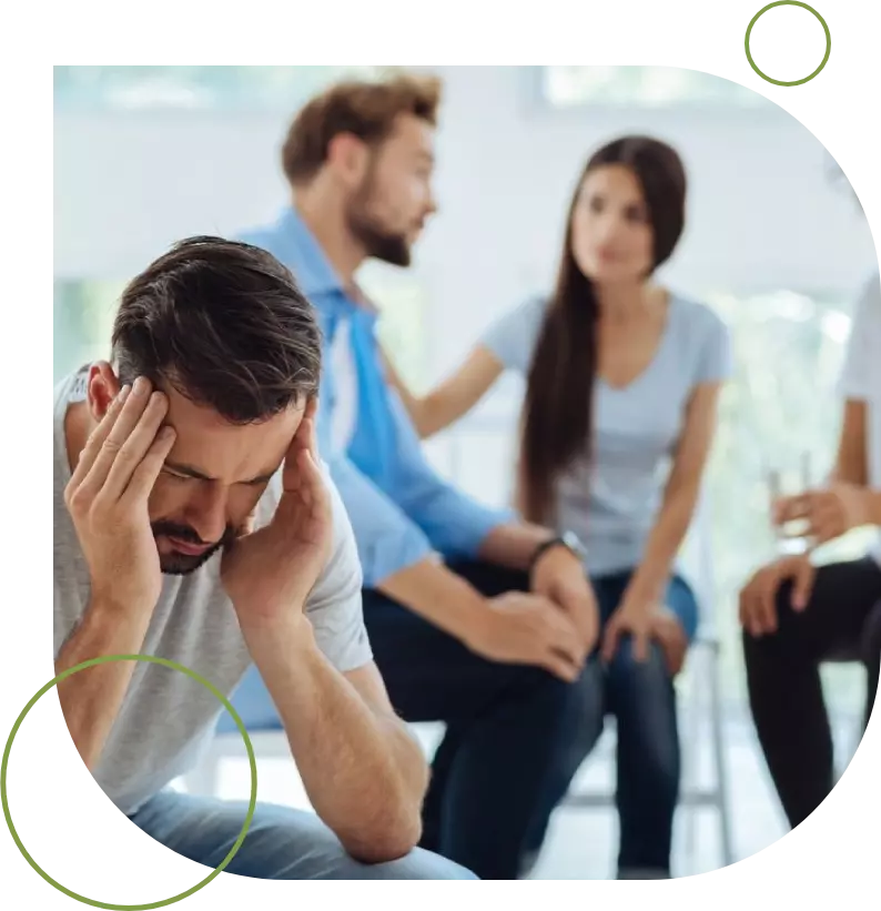 A group of people sitting around in a room.