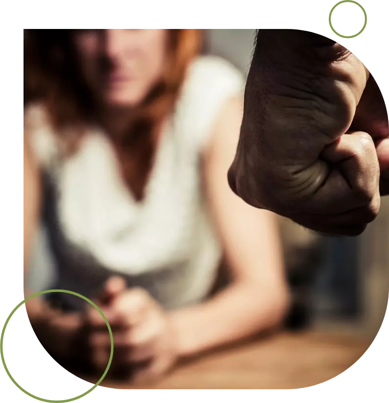 A woman sitting on the floor with her feet in front of another person.