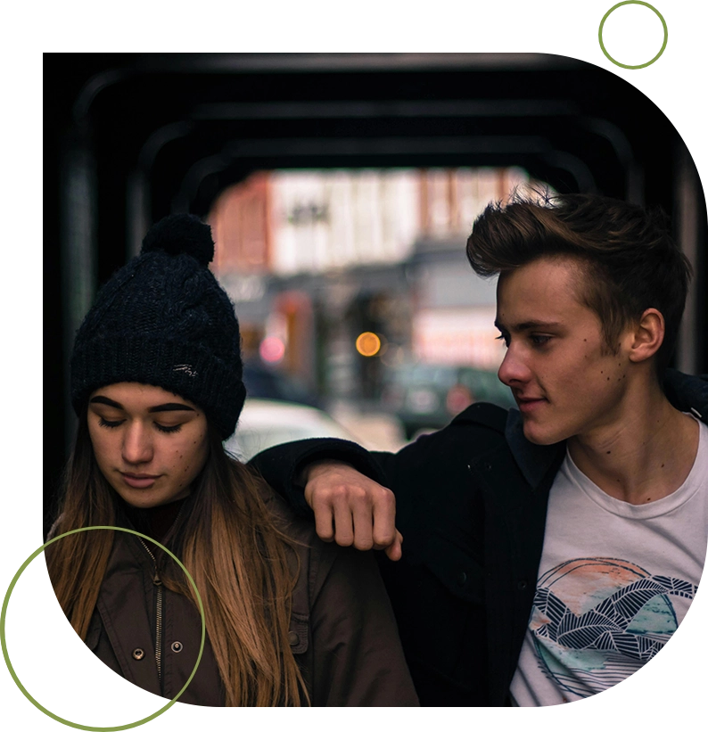 A man and woman are sitting on the bus.