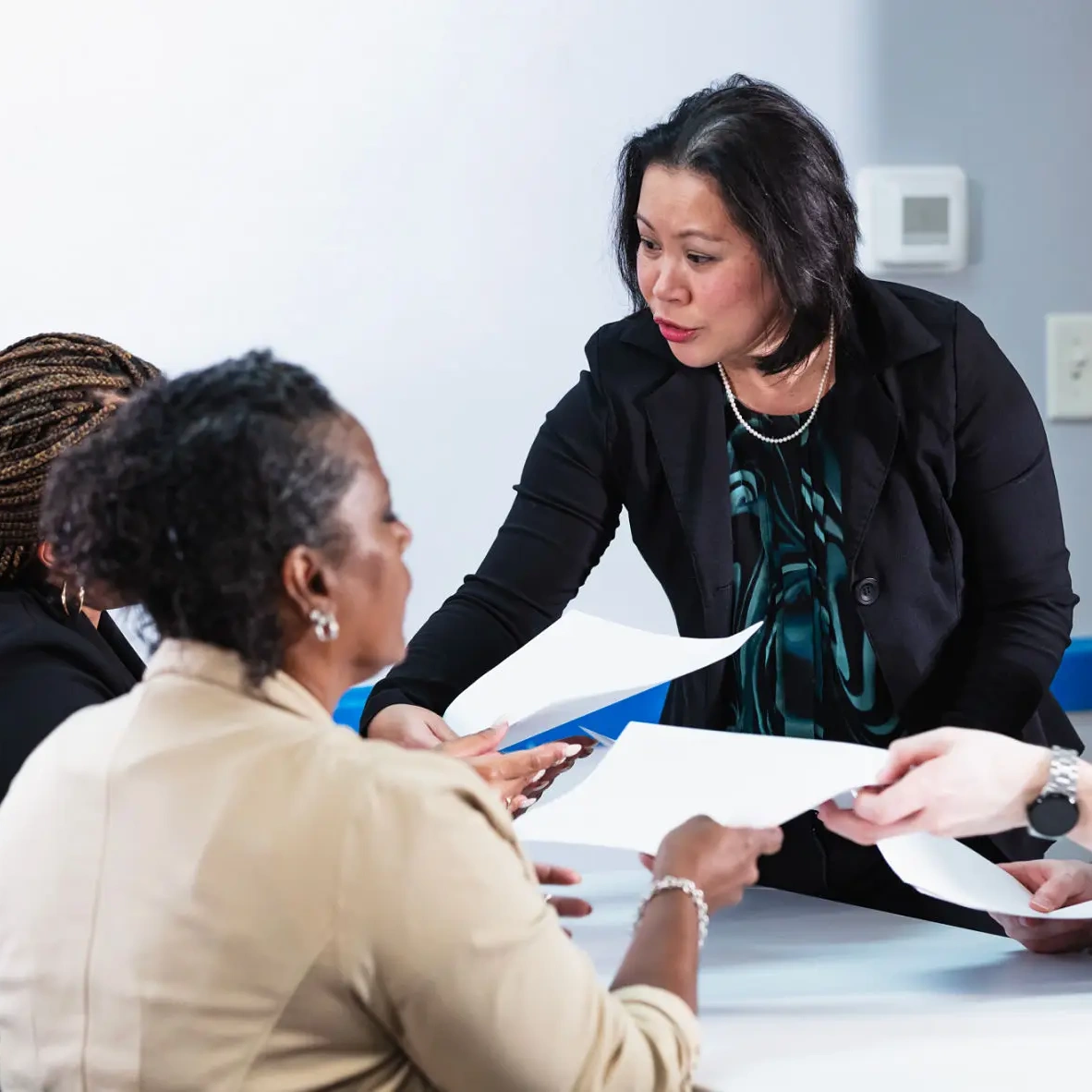 Team discussing documents together