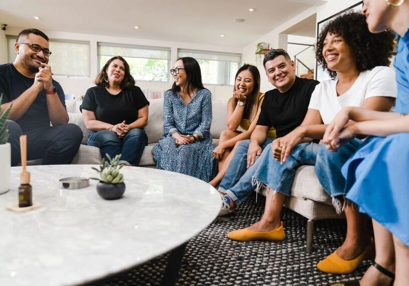 A group of people sitting around a table.